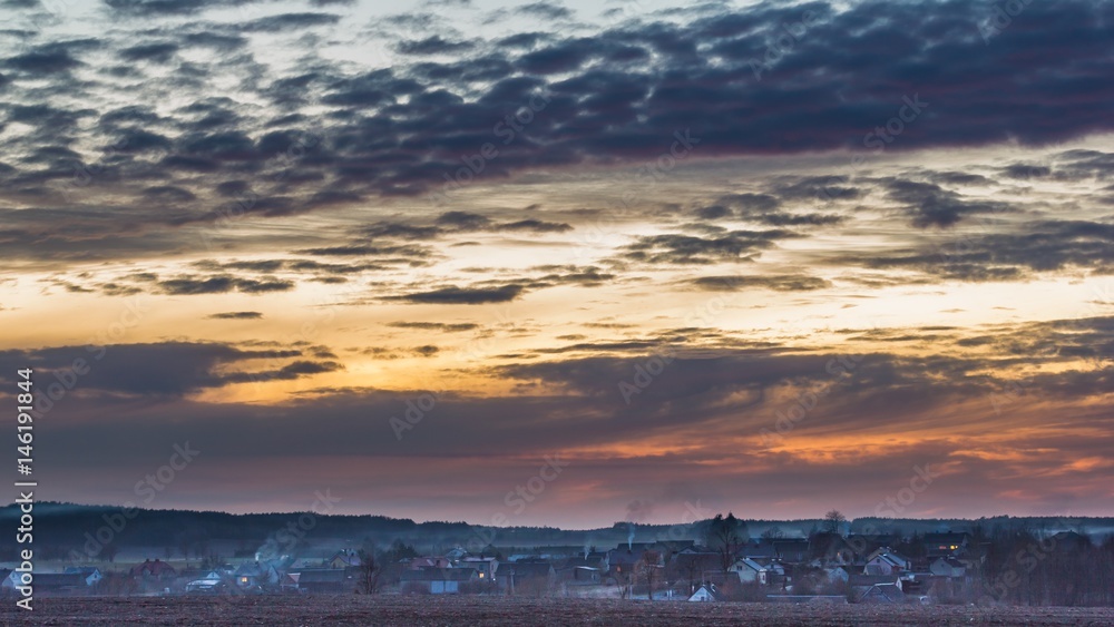 Sunset colorful sky over polish village in spring Sunset colorful sky over polish village in spring
