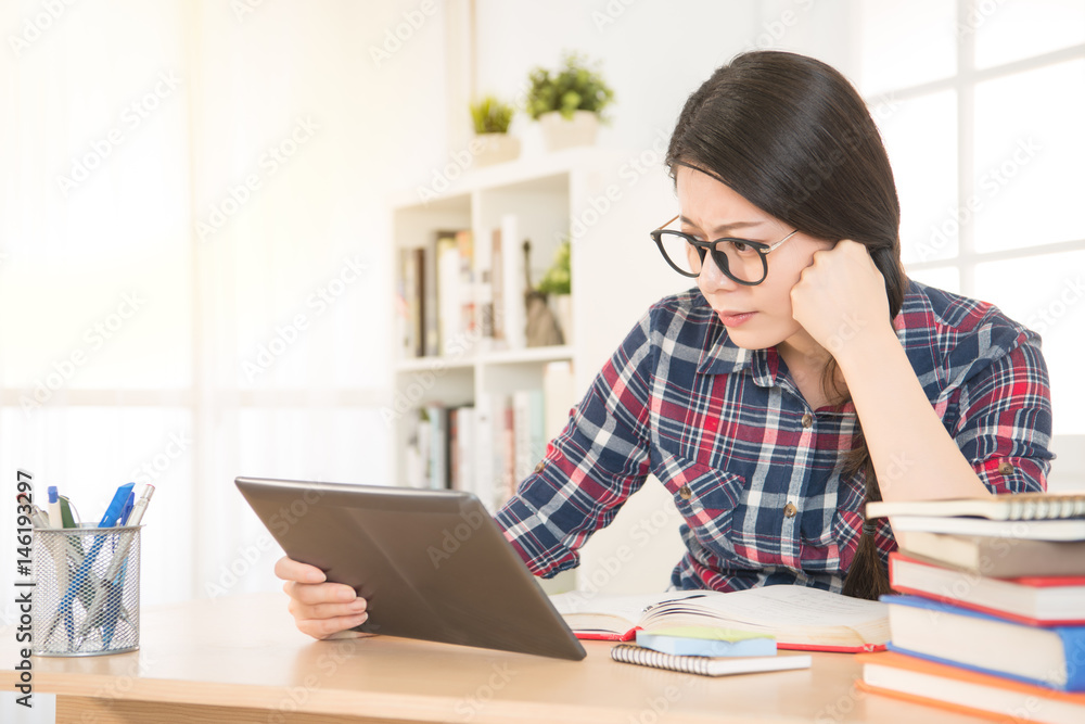 focused student using a tablet computer focused student using a tablet computer