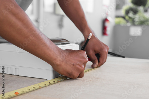 electrician working on design and installing circuit breakers