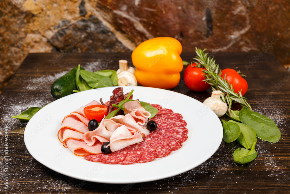 Dish with sliced meat products Dish with sliced meat products
