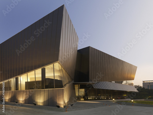 Exterior view of illuminated modern building photo