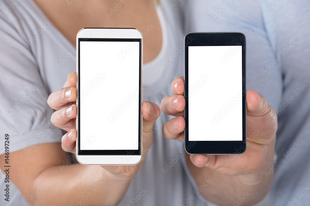 Couple Showing Blank Cellphone Couple Showing Blank Cellphone