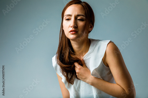 young woman having a heart ache photo