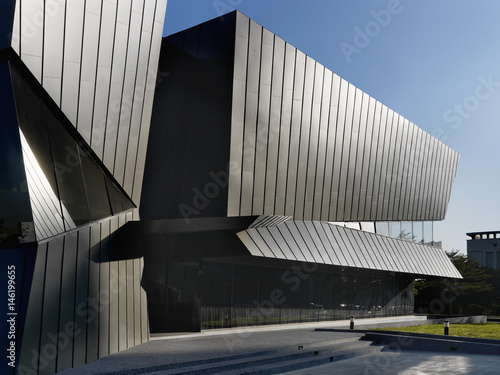 Exterior view of modern building against blue sky photo