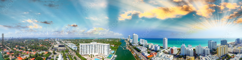 Miami Beach buildings and coastline - Panoramic aerial view at sunset