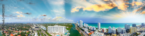 Miami Beach buildings and coastline - Panoramic aerial view at sunset © jovannig