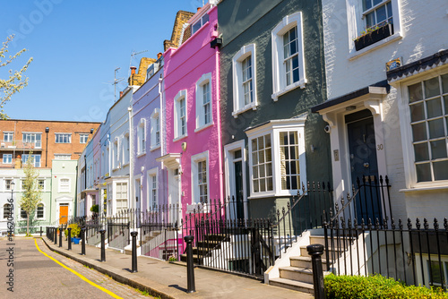 Pastel colored restored Victorian British houses in an elegant mews in Chelsea, London, UK