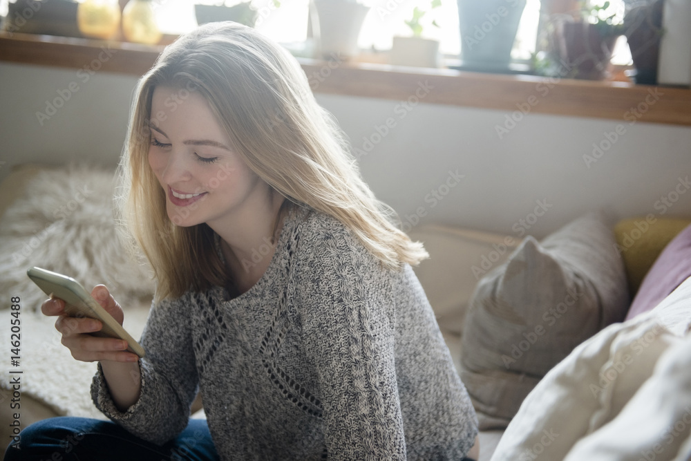 Smiling woman using smart phone Smiling woman using smart phone