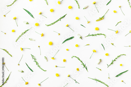 Flowers composition. Pattern made of yellow flowers on white background. Flat lay, top view