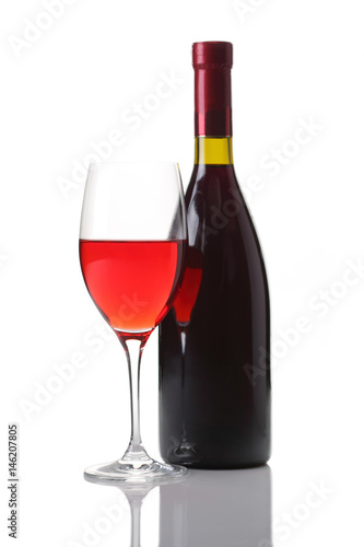 Wineglass and bottle of red wine isolated on white