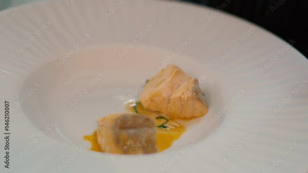 The cook in the restaurant prepares and serves an appetizing dish 4k The cook in the restaurant prepares and serves an appetizing dish 4k