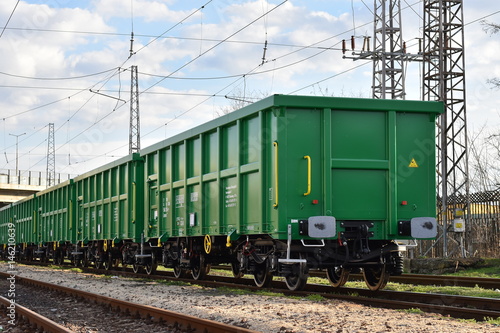 Burgas, Bulgaria - March 20, 2017 - Freight cargo train - 4axled box wagon green Type:Eanos Model:155-1 - Transvagon AD