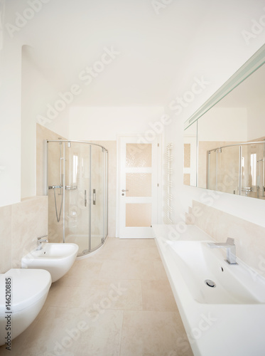 Wide beige bathroom