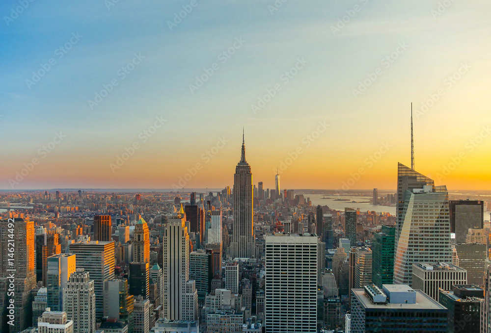 New York City skyline with urban skyscrapers at sunset