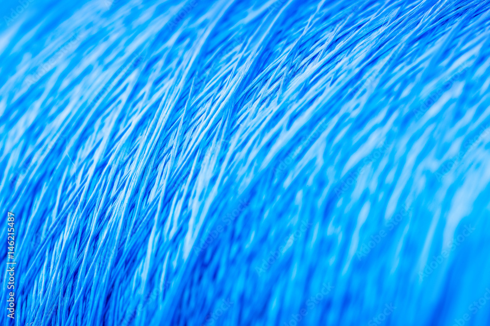 reel blue silk thread. textile concept. abstract background reel blue silk thread. textile concept. abstract background