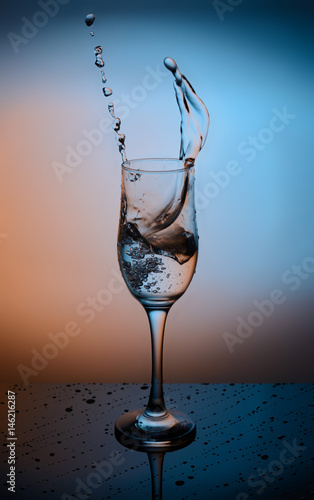 Splash of water into the glass.