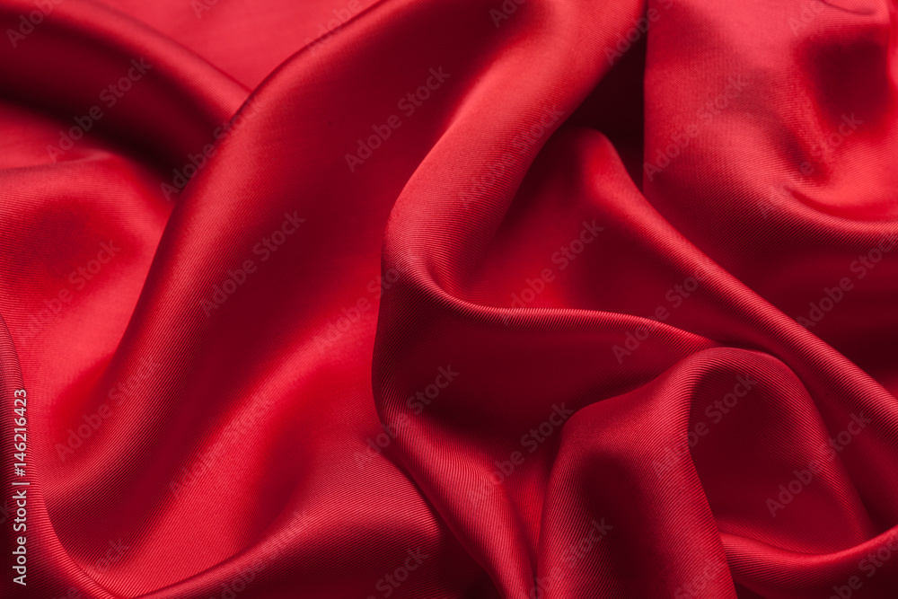 Fototapeta premium Red cloth waves background texture