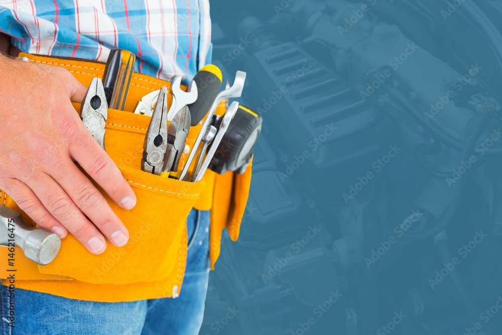 Midsection of handyman with tools Midsection of handyman with tools