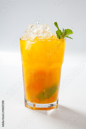 Summer lemonade with orange, ice and mint