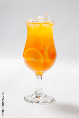 Drink with lemon, orange and ice on white background