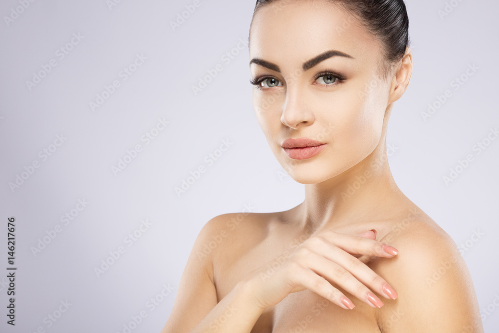 Gorgeous girl with nude make up at studio background Gorgeous girl with nude make up at studio background