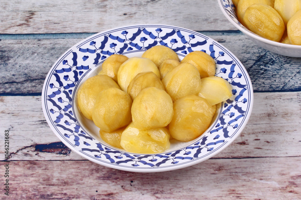 Mini green mango compote served in Thai pattern plate. Mini green mango compote served in Thai pattern plate.