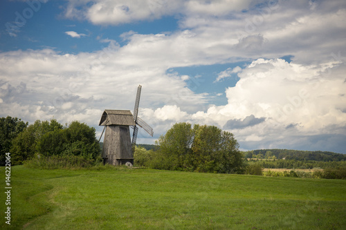 Beautiful rural landscape with old windmill © idea_studio