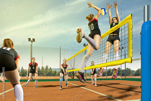 Female volleyball players h...