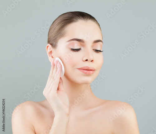 Beautiful Healthy Woman with White Cotton Pads. Hygienic, Cleansing and Facial Treatment Concept