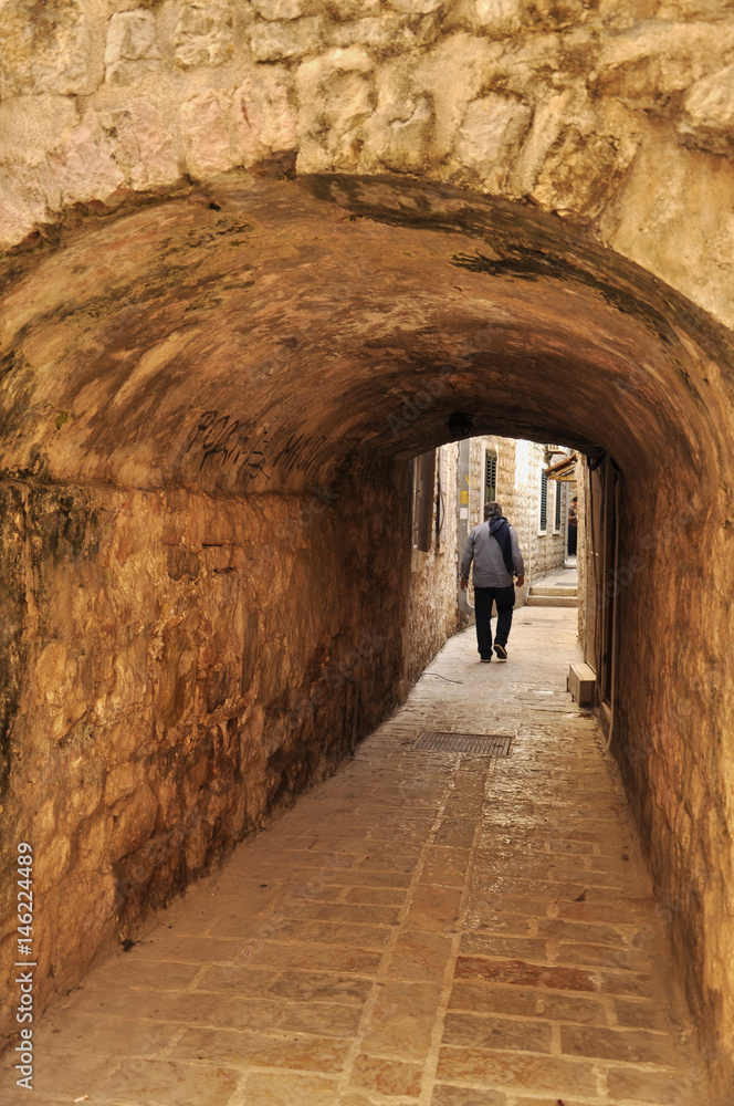 The man at the exit of the tunnel in the old town of Budva