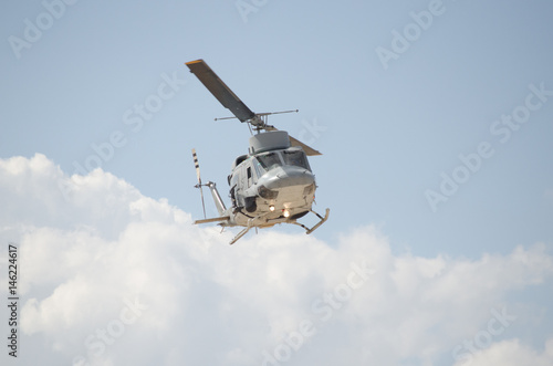 Helicopter bell uh 1 clouds
