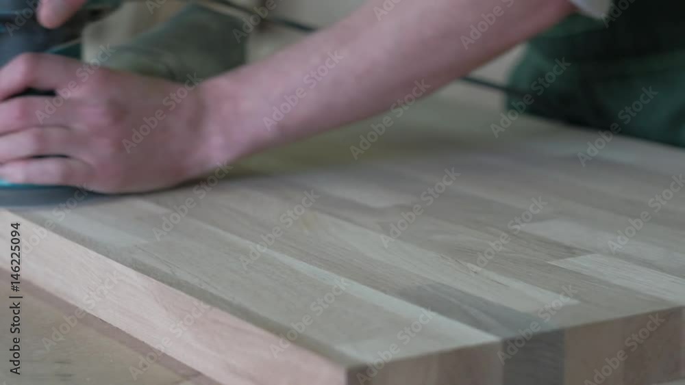 Man Polishing Wooden Surface, Works as a Grinder Man Polishing Wooden Surface, Works as a Grinder