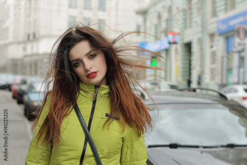 Portrait of a stylish girl who walks around the city