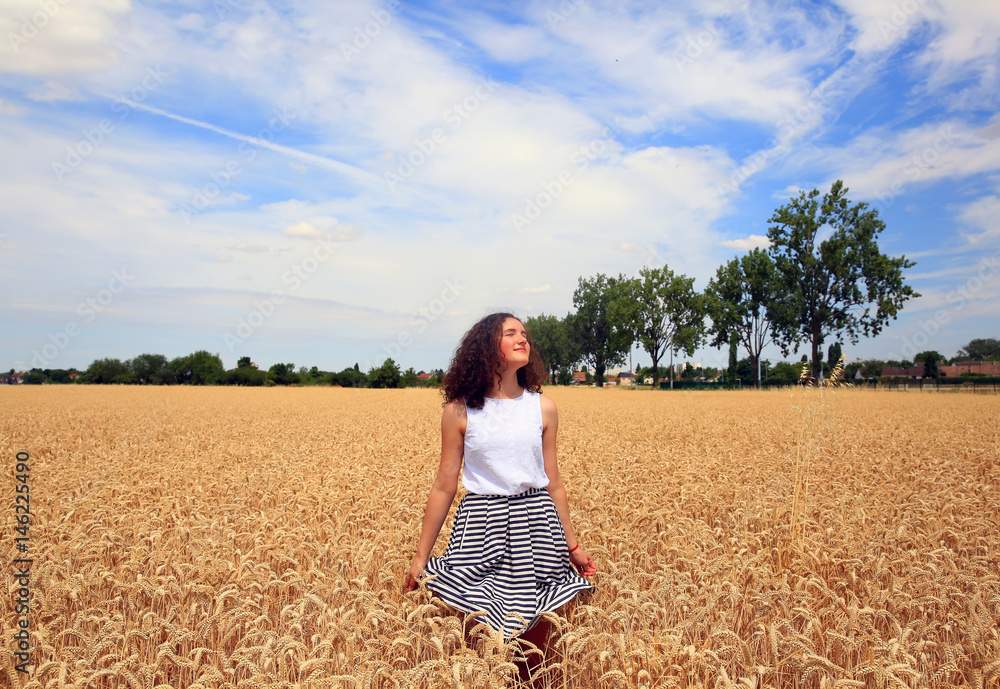Young girl have fun in the wheat field Young girl have fun in the wheat field