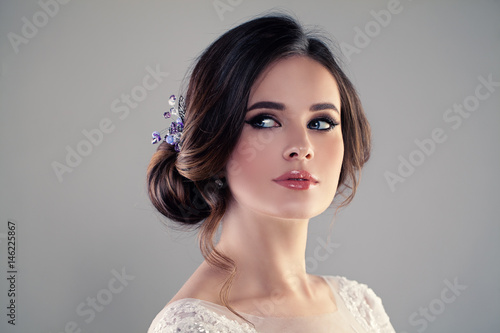 Beautiful Bride with Wedding Hairstyle and Make up. Studio Portrait of Young Gorgeous Bride. Perfect Fiancee