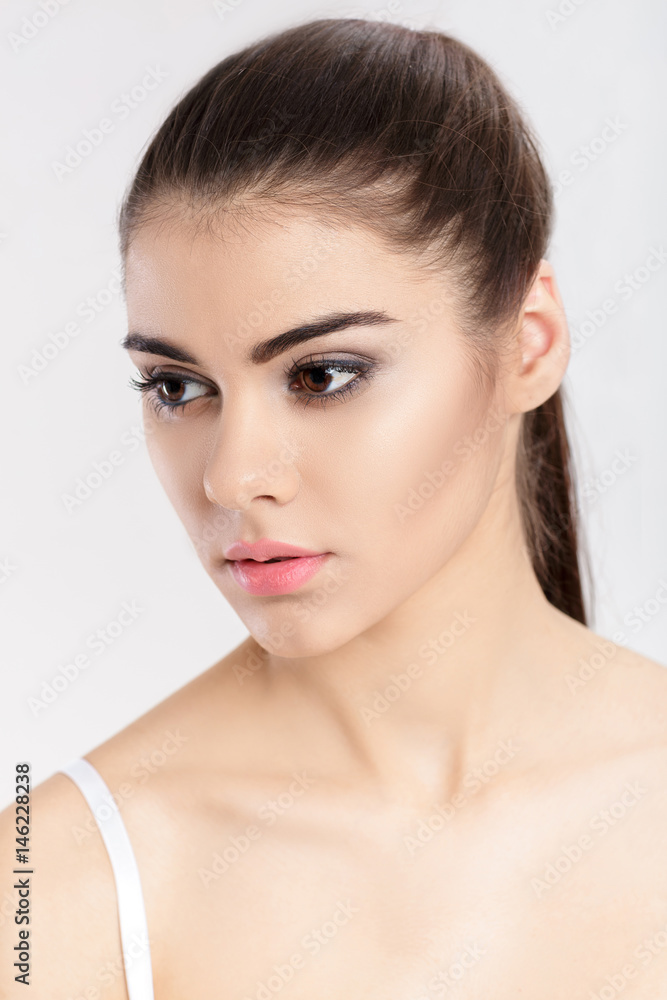 portrait of young beautiful woman brunette with natural makeup. girl with clean skin portrait of young beautiful woman brunette with natural makeup. girl with clean skin