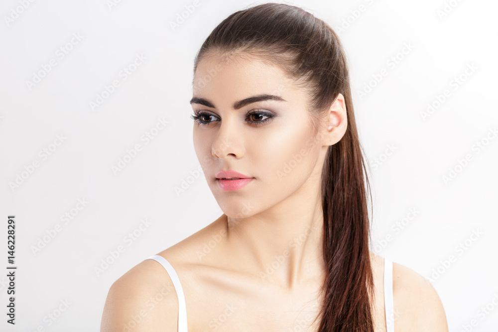 portrait of young beautiful woman brunette with natural makeup. girl with clean skin portrait of young beautiful woman brunette with natural makeup. girl with clean skin