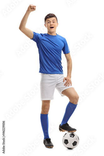 Teenage football player gesturing happiness