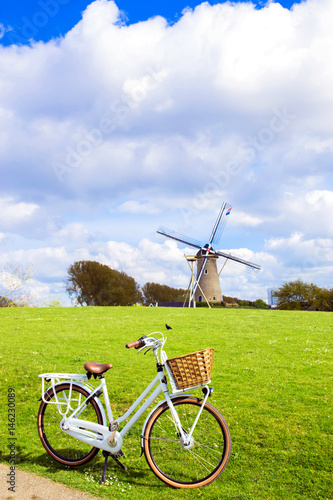 Bicycle and windmill. Bicycle travel concept.