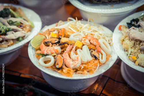 Noodles with seafood. Night food market, Thailand.