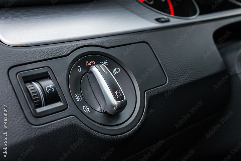 Detail Of The Headlight Button In Car Dashboard Detail Of The Headlight Button In Car Dashboard