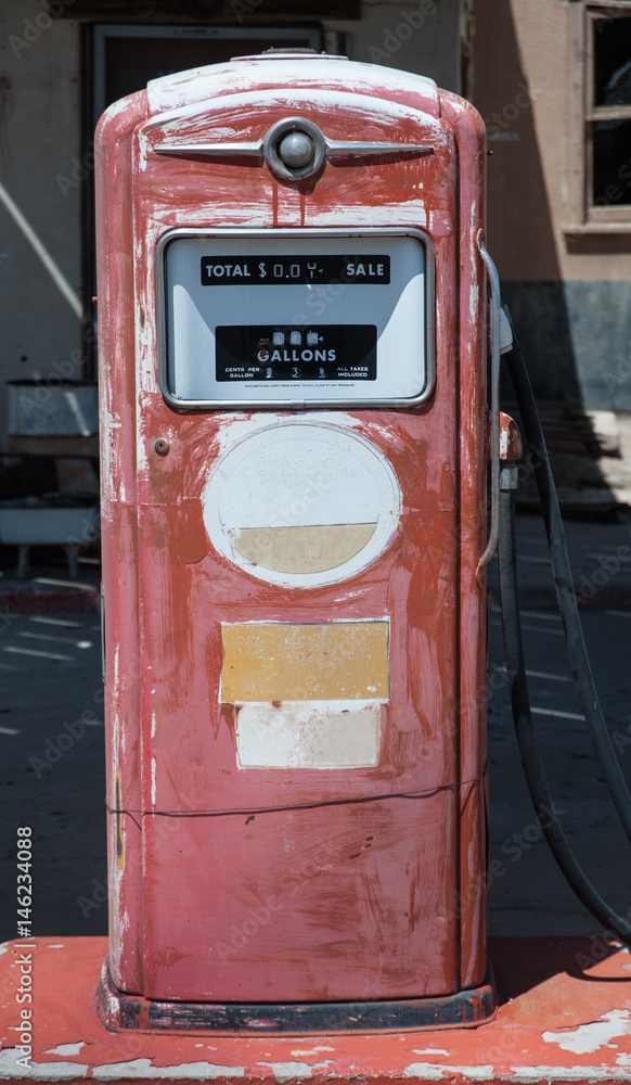 Aged old vintage gas station fuel pump abandoned on route 66 in