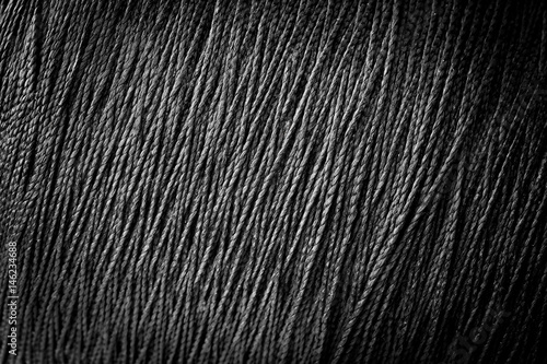 reel black synthetic thread. textile concept. abstract background