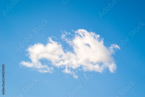 blue sky with  one single white cloud