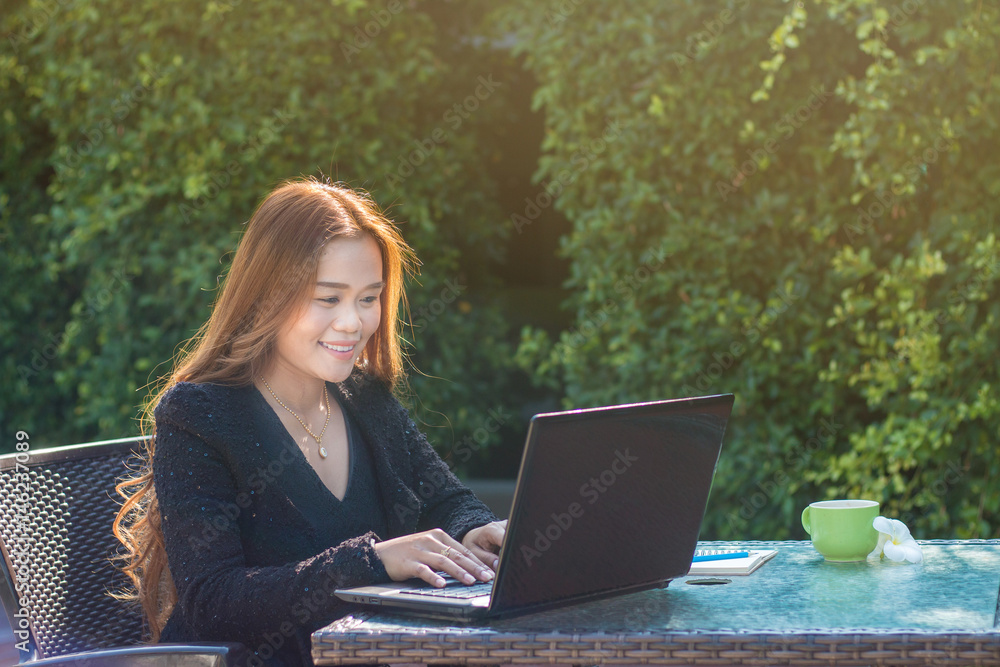 Asian young woman using with laptop Asian young woman using with laptop