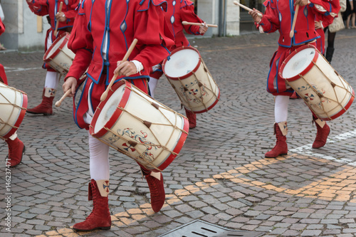 Drummers in Red and White Uniform Playing Snare Drums