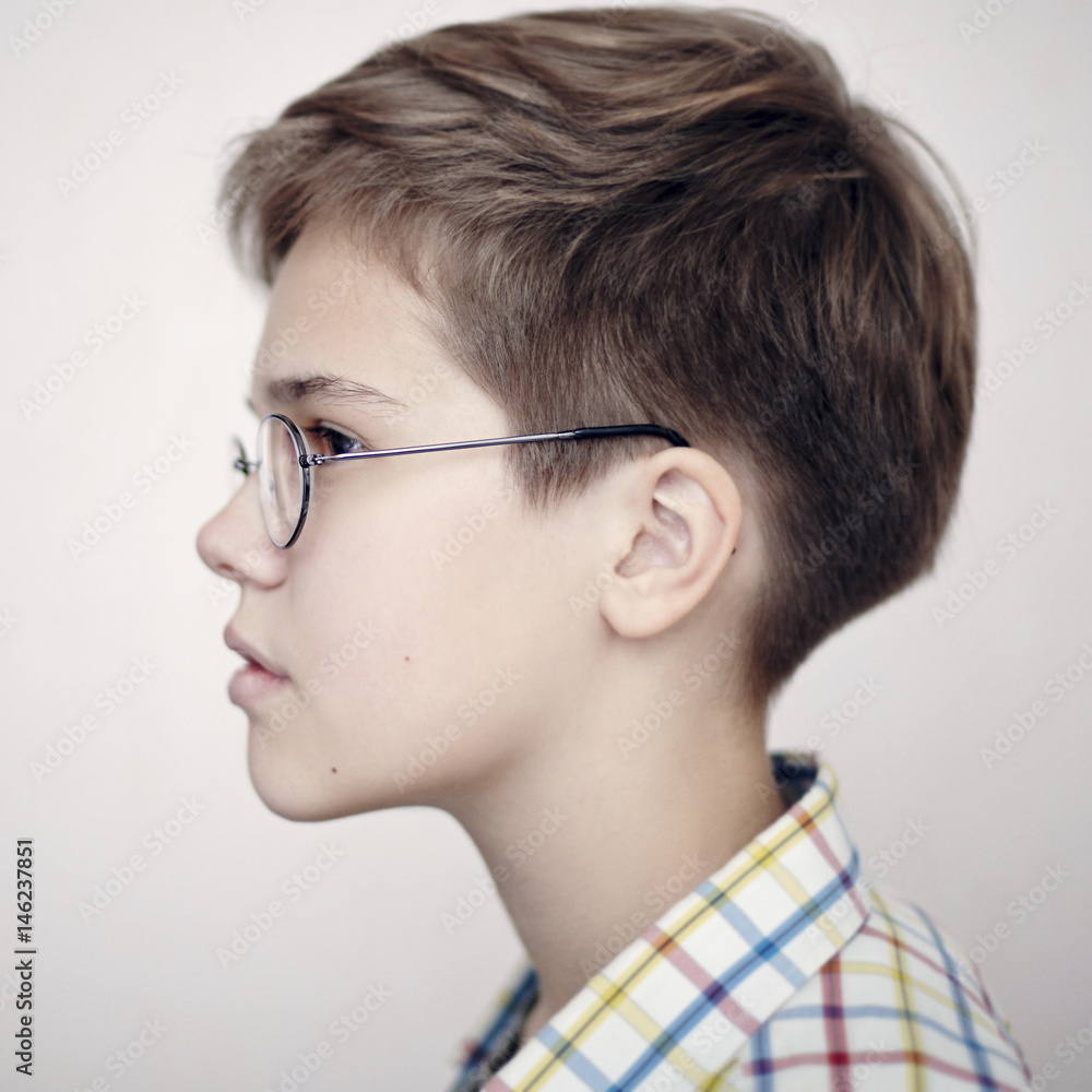 Profile of Caucasian boy wearing eyeglasses Profile of Caucasian boy wearing eyeglasses