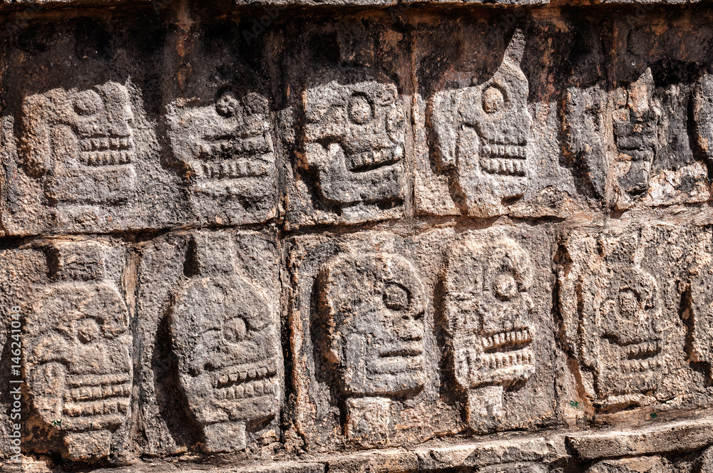 Detail Carvings at the platform of Skulls in the ancient Mayan ruins of Chichen Itza in Mexico.