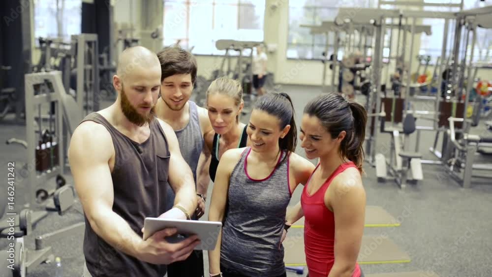Young people in crossfit gym, taking selfie with tablet. Young people in crossfit gym, taking selfie with tablet.