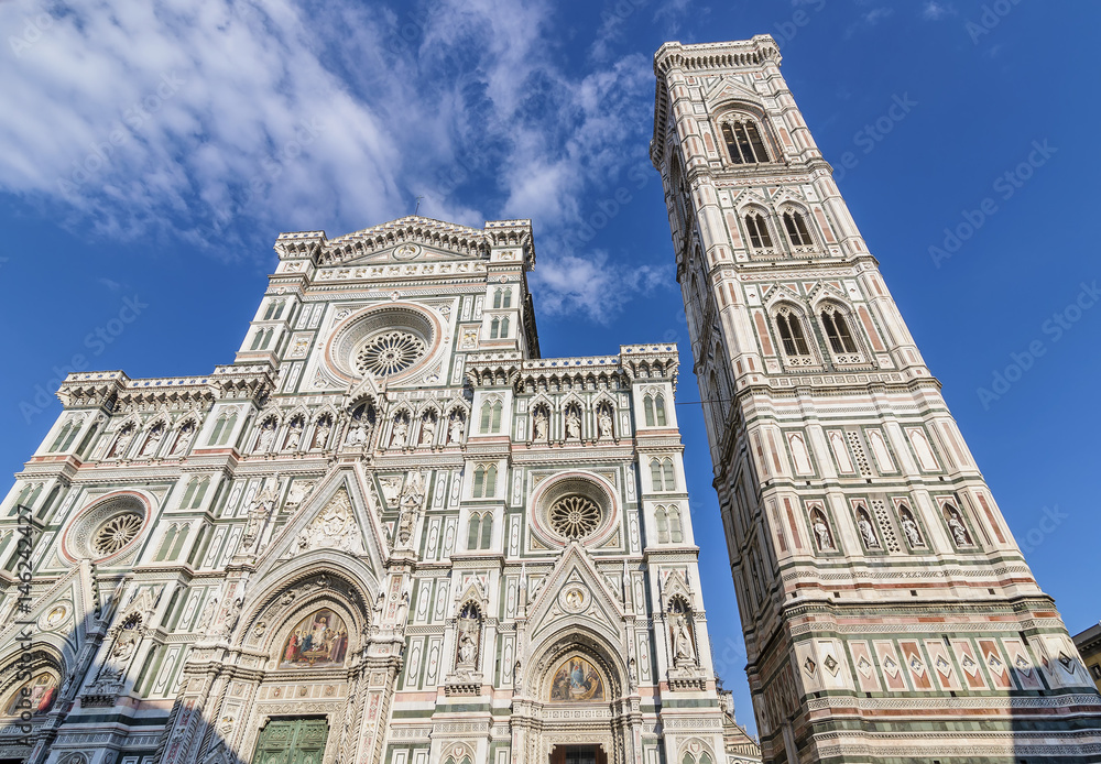 Bottom view of the facade of the famous Cathedral of Santa Maria del Fiore, Duomo of Florence, Italy, on a sunny day